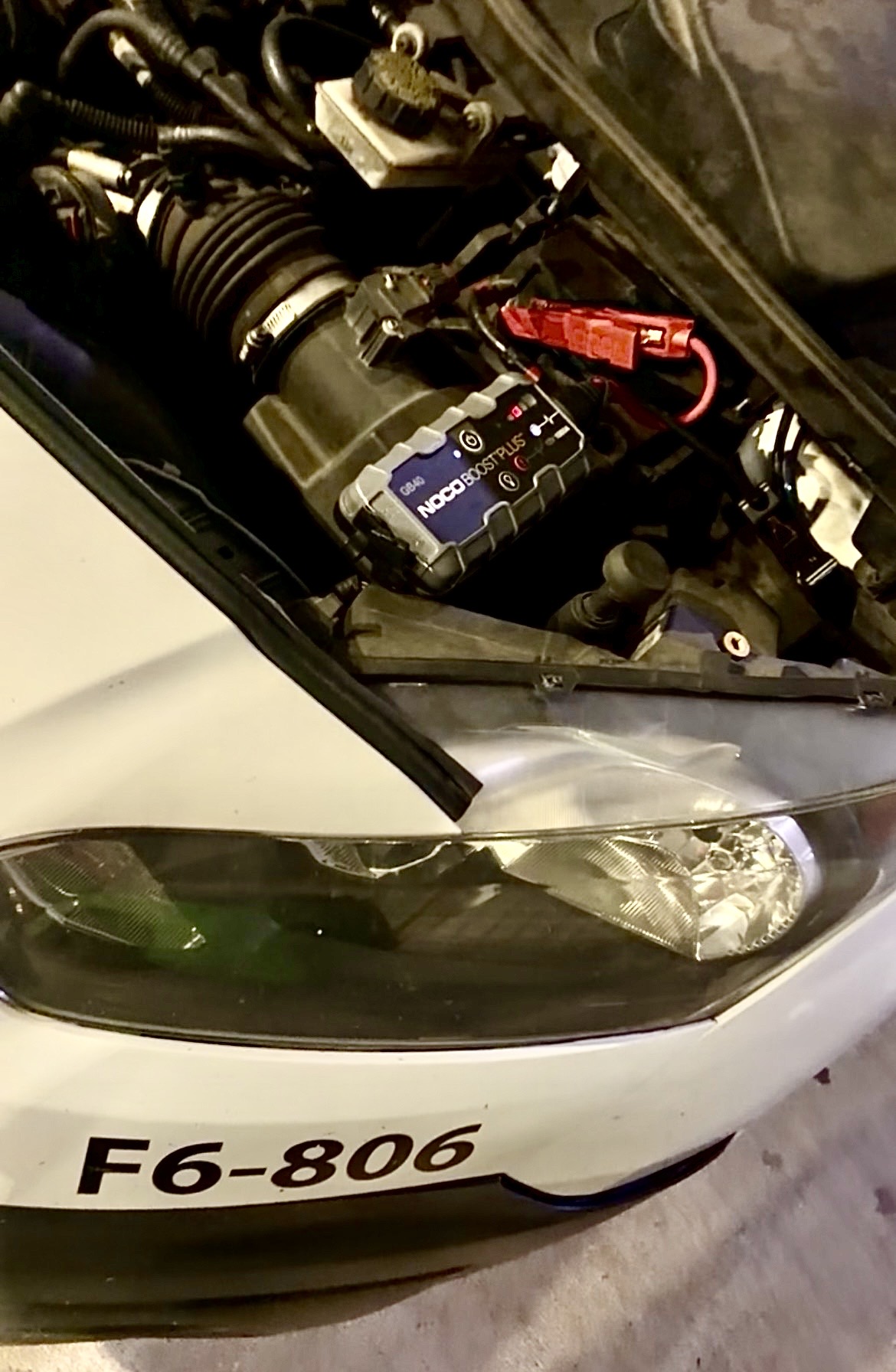 NOCO Boost Plus jump starter connected to a vehicle battery