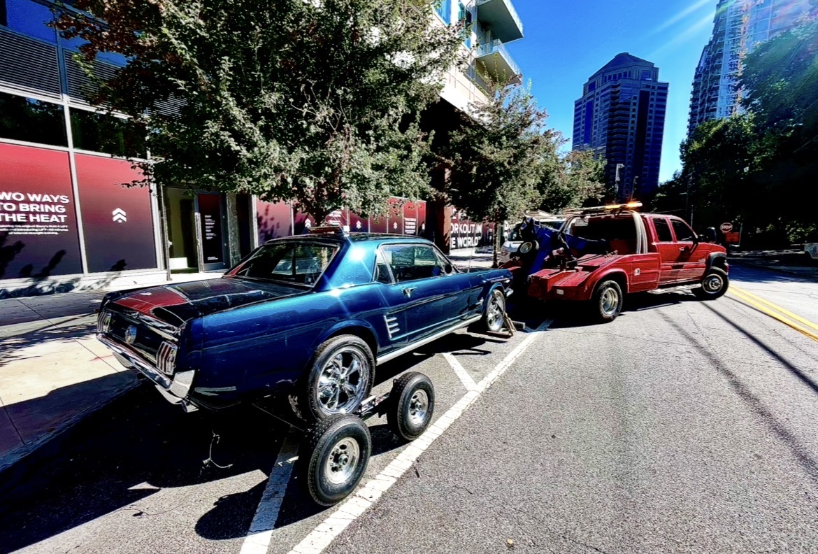 Tow truck towing classic Mustang in Atlanta