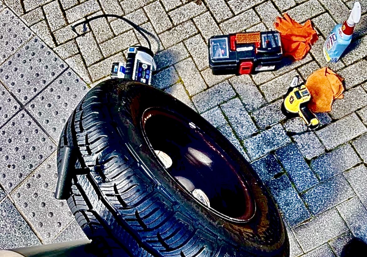 Mobile tire plug repair tools and tire on pavement in Atlanta